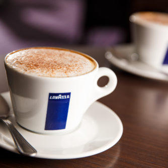 Two cups of coffee on table in Lavazza coffee shop cafe at Mercure Wetherby Hotel