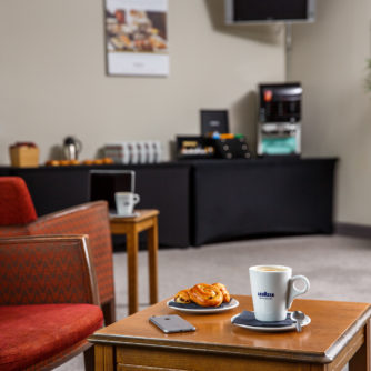 The meeting lounge area at Mercure Wetherby Hotel, coffee & pastries on table